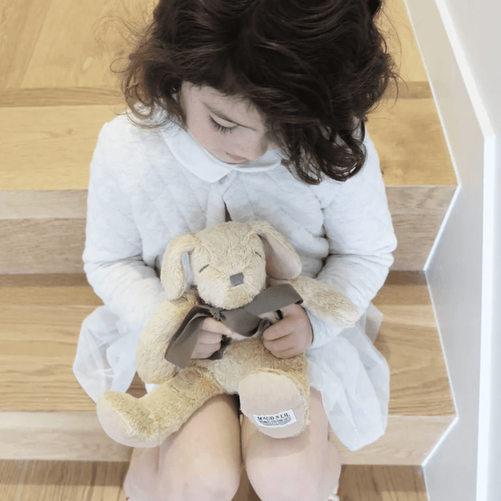Little-Girl-Cuddling-With-Maud-N-Lil-Organic-Fluffy-Puppy-Soft-Toy-Naked-Baby-Eco-Boutique