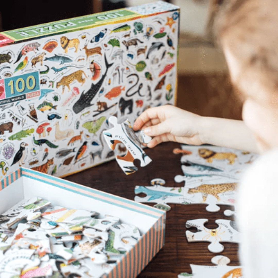 Little-Girl-Doing-Puzzle-Eeboo-100-Piece-Puzzle-Beautiful-World-Naked-Baby-Eco-Boutique