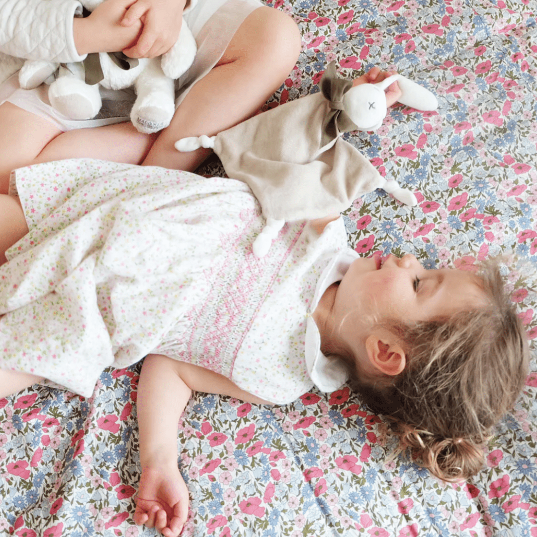 Little-Girl-Lying-with-Maud-N-Lil-Organic-Bunny-Dou-Dou-Comforter-Toy-Grey-Naked-Baby-Eco-Boutique