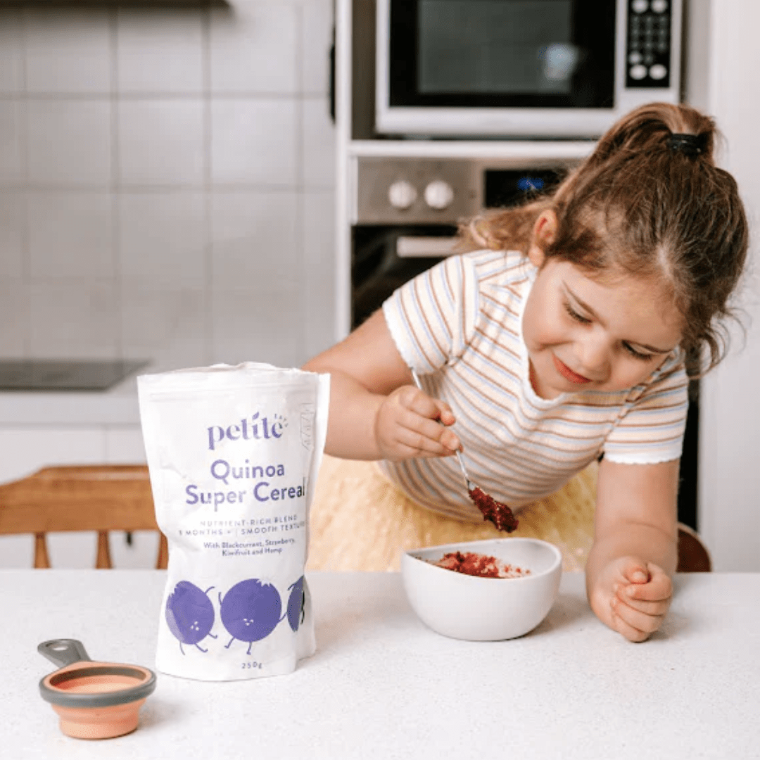 Little-Girl-Making-Petite-Eats-Quinoa-Super-Cereal-Naked-Baby-Eco-Boutique