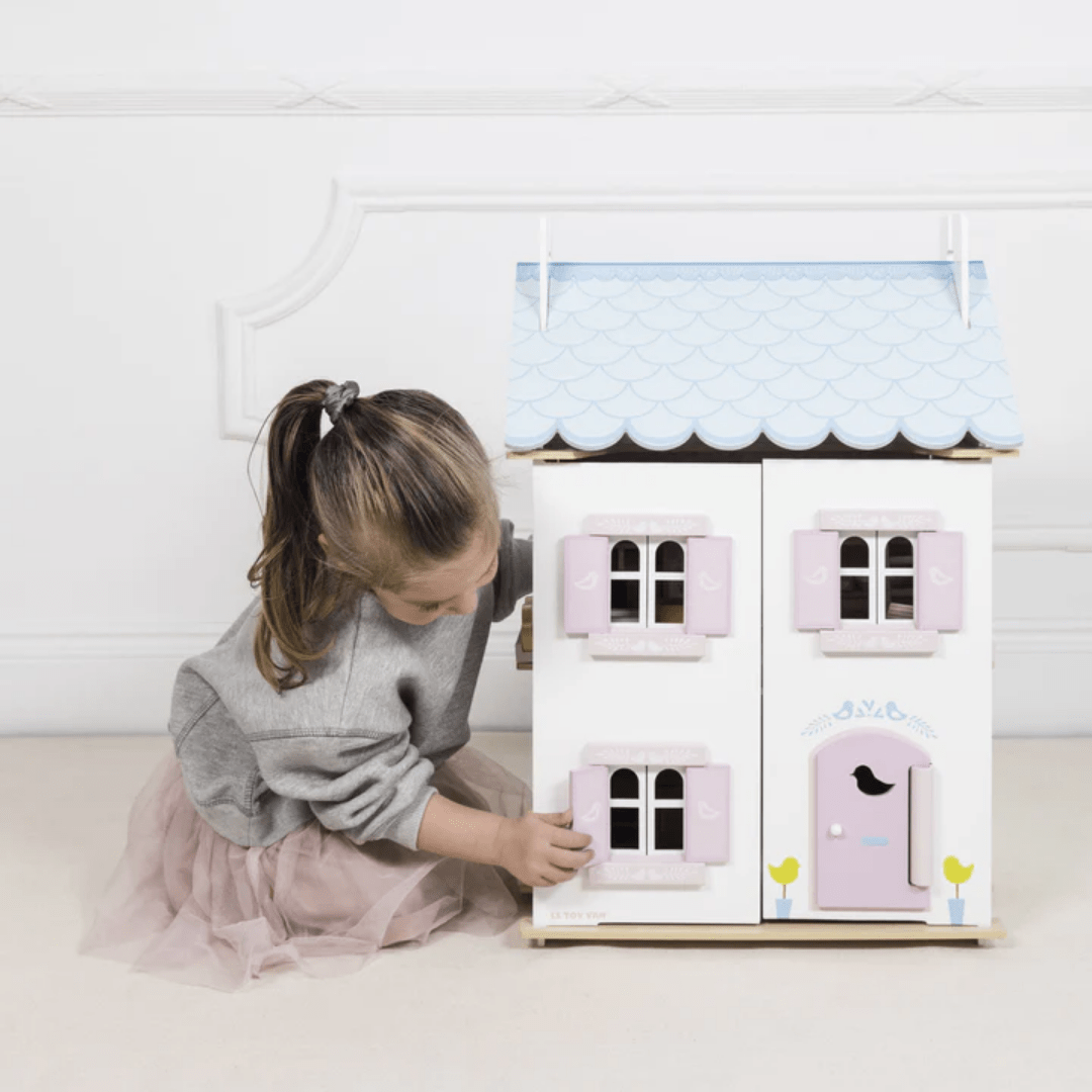 Little-Girl-Playing-With-Bluebird-Cottage-With-Furniture-Dollhouse-Naked-Baby-Eco-Boutique