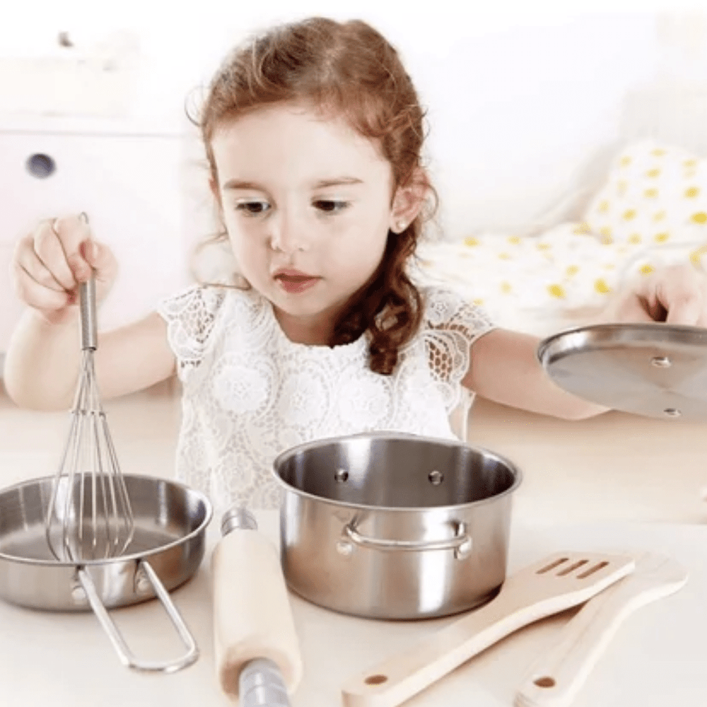 Little-Girl-Playing-With-Hape-Chefs-Cooking-Set-Naked-Baby-Eco-Boutique