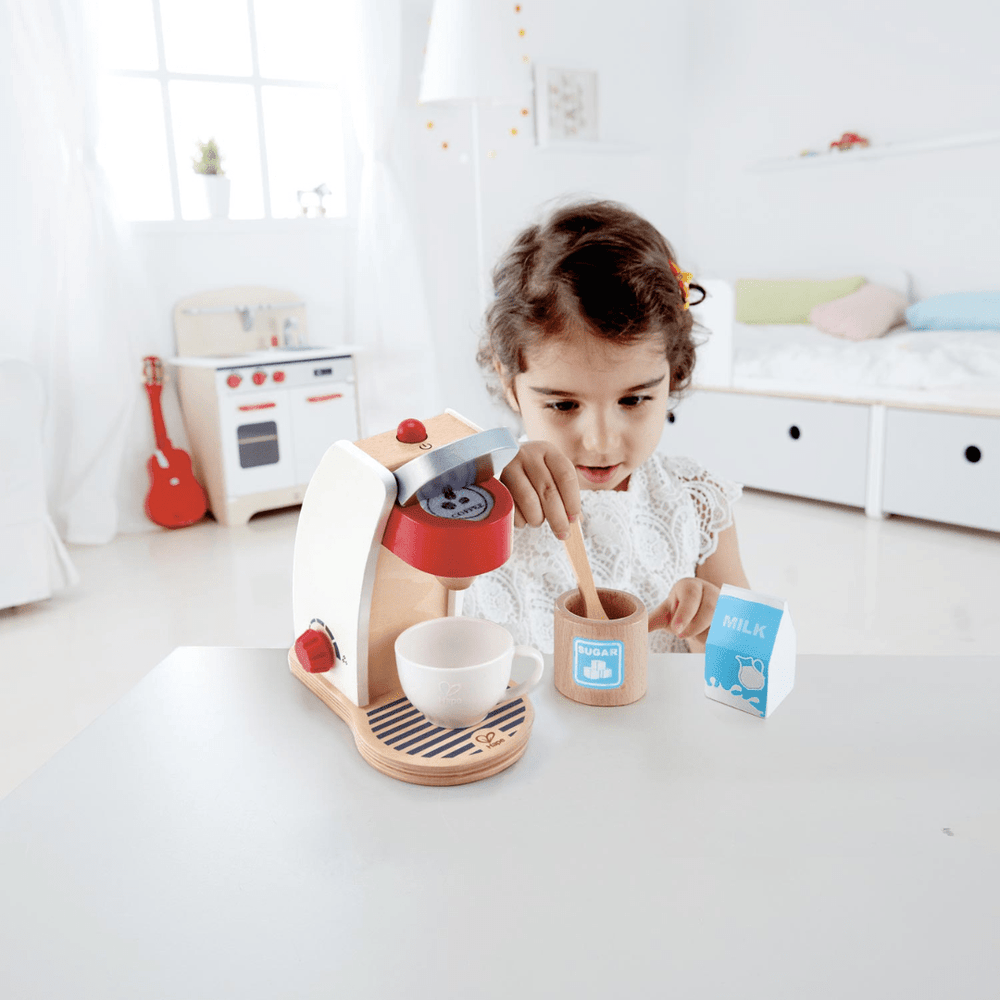 Little-Girl-Playing-With-Hape-My-Coffee-Machine-Naked-Baby-Eco-Boutique