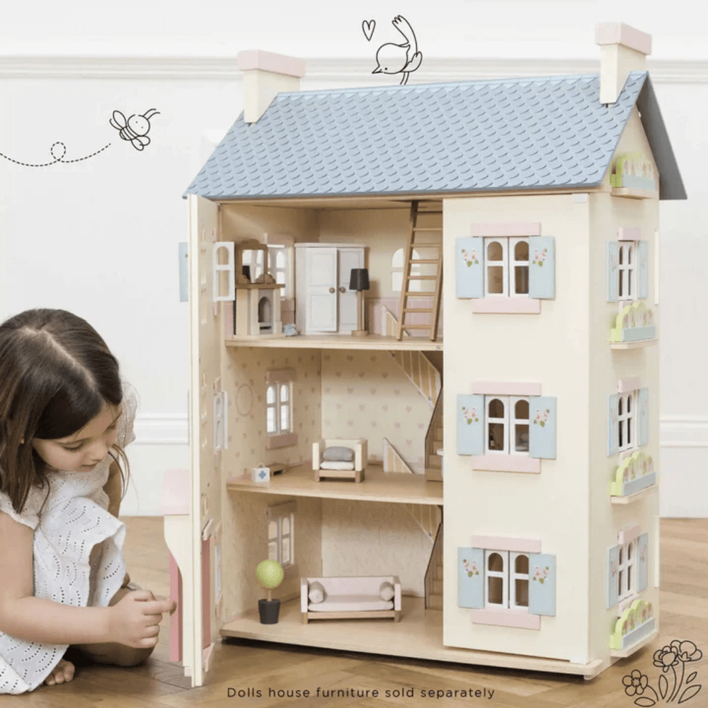 Little-Girl-Playing-With-Le-Toy-Van-Cherry-Tree-Hall-Dollhouse-Naked-Baby-Eco-Boutique