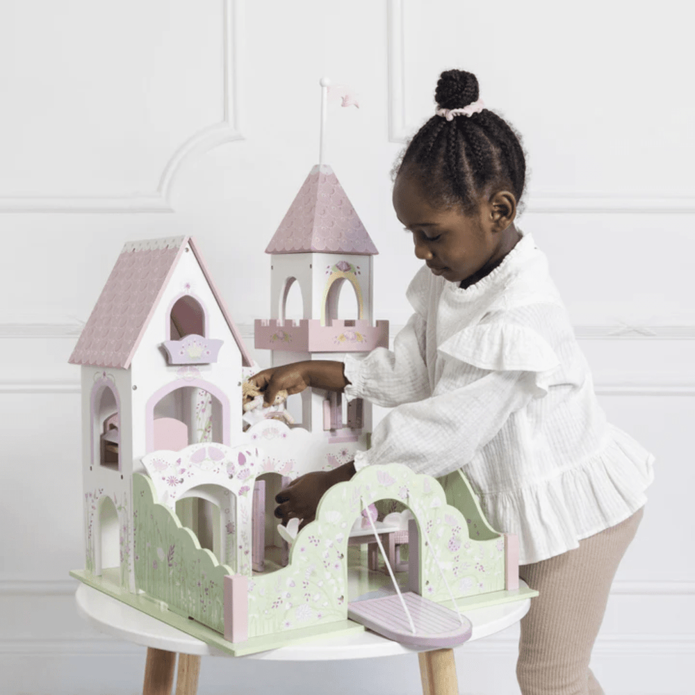 Little-Girl-Playing-With-Le-Toy-Van-Fairybelle-Palace-Dollhouse-Naked-Baby-Eco-Boutique