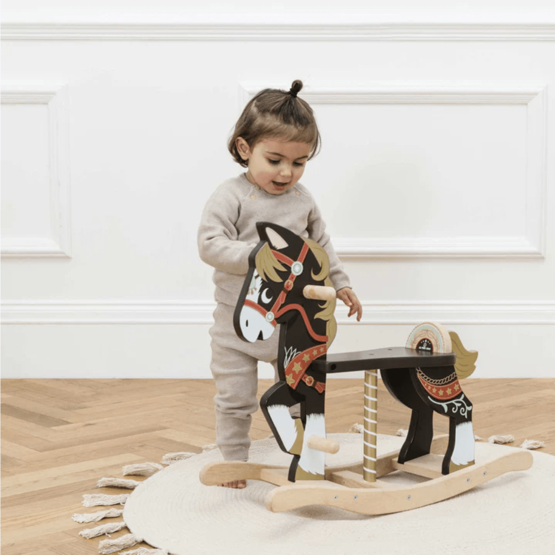Little-Girl-Playing-With-Le-Toy-Van-Rocking-Horse-Naked-Baby-Eco-Boutique