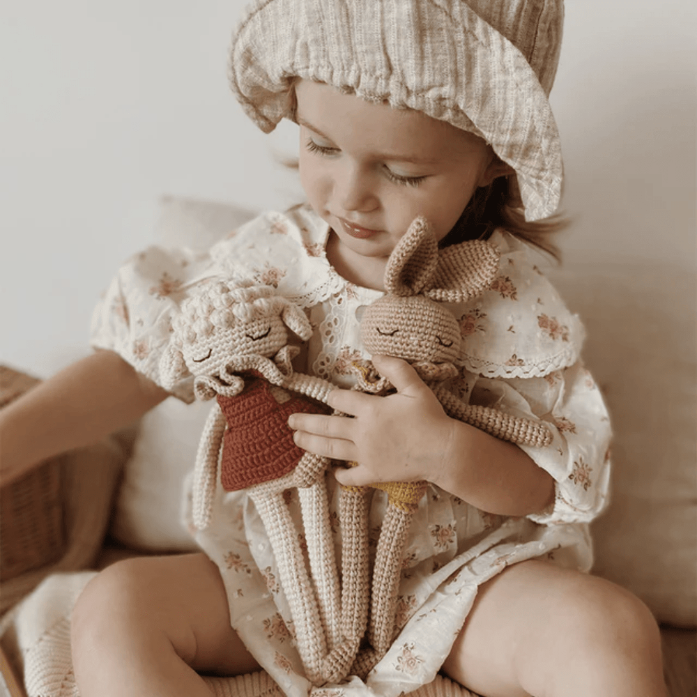 Little-Girl-Playing-With-Patti-Oslo-Organic-Cotton-Bianca-Bunny-Naked-Baby-Eco-Boutique