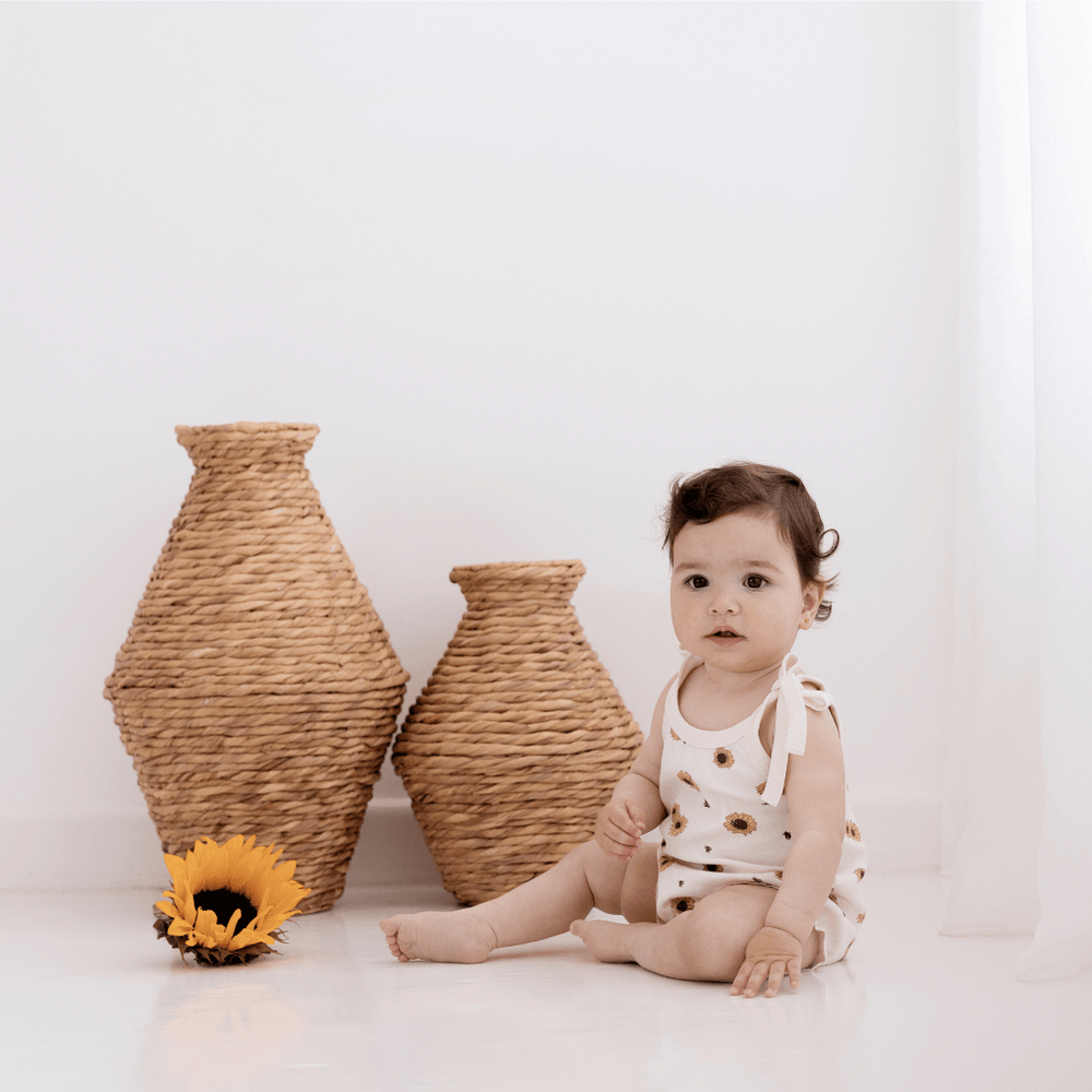 Little-Girl-Wearing-Aster-And-Oak-Organic-Cotton-Bubble-Romper-Naked-Baby-Eco-Boutique