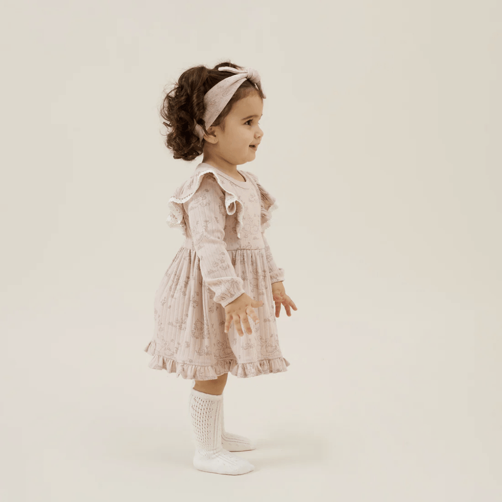 Little-Girl-Wearing-Aster-And-Oak-Organic-Duck-Family-Ruffle-Dress-Naked-Baby-Eco-Boutique