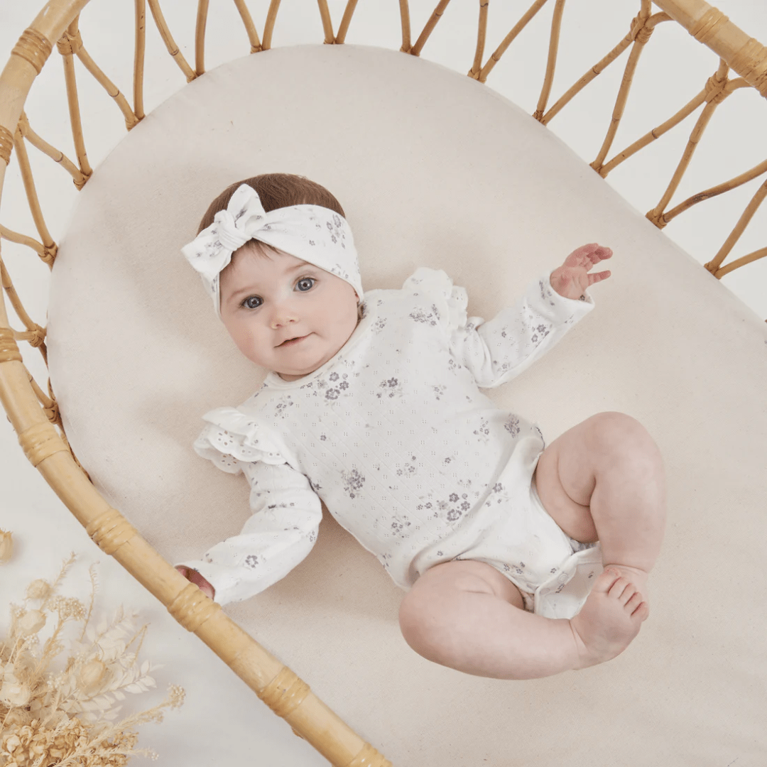 Little-Girl-Wearing-Aster-And-Oak-Organic-Grace-Floral-Flutter-Onesie-With-Matching-Headband-Naked-Baby-Eco-Boutique
