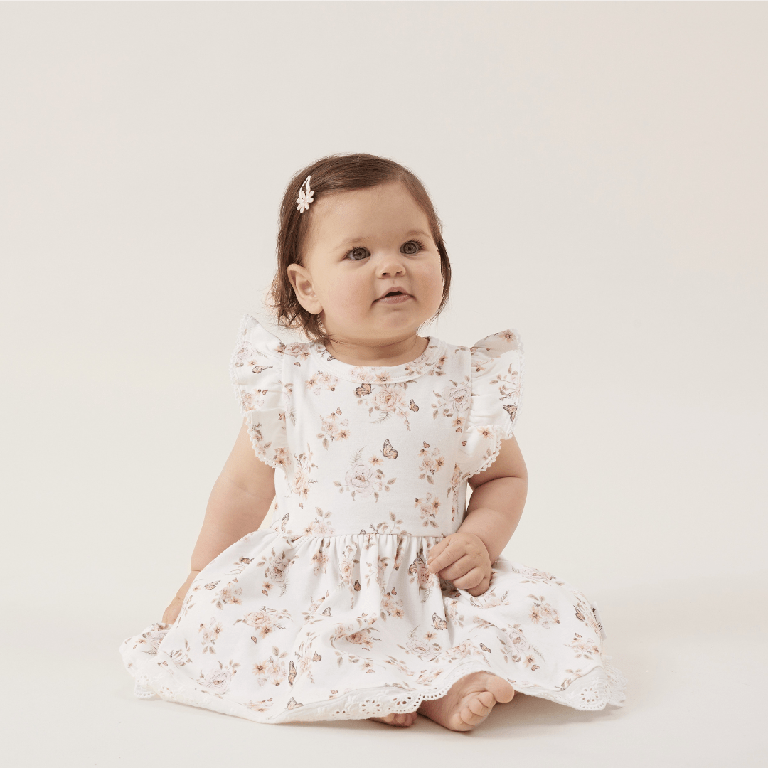 Little-Girl-Wearing-Aster-And-Oak-Organic-Butterfly-Ruffle-Dress-Naked-Baby-Eco-Boutique