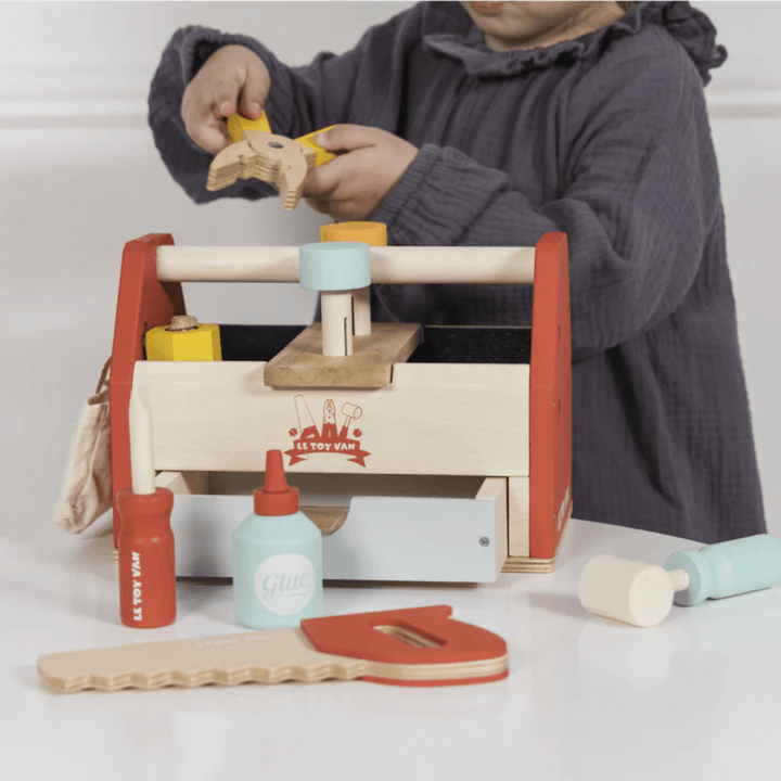 Little-Hands-Playing-With-Le-Toy-Van-Tool-Box-Naked-Baby-Eco-Boutique