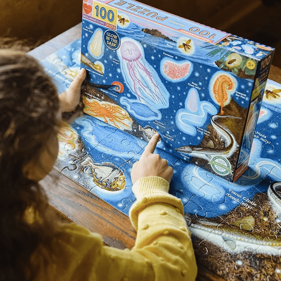 Little-Kid-Doing-Puzzle-Eeboo-100-Piece-Puzzle-Bioluminescent-In-Box-Naked-Baby-Eco-Boutique