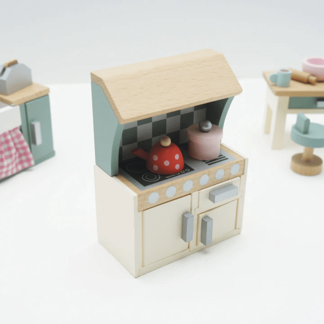 The Le Toy Van Daisylane Kitchen Dollhouse Furniture set, from the brand Le Toy Van, is the perfect addition to any playroom. This wooden doll furniture set includes a stove and oven, allowing children to whip up imaginary meals.