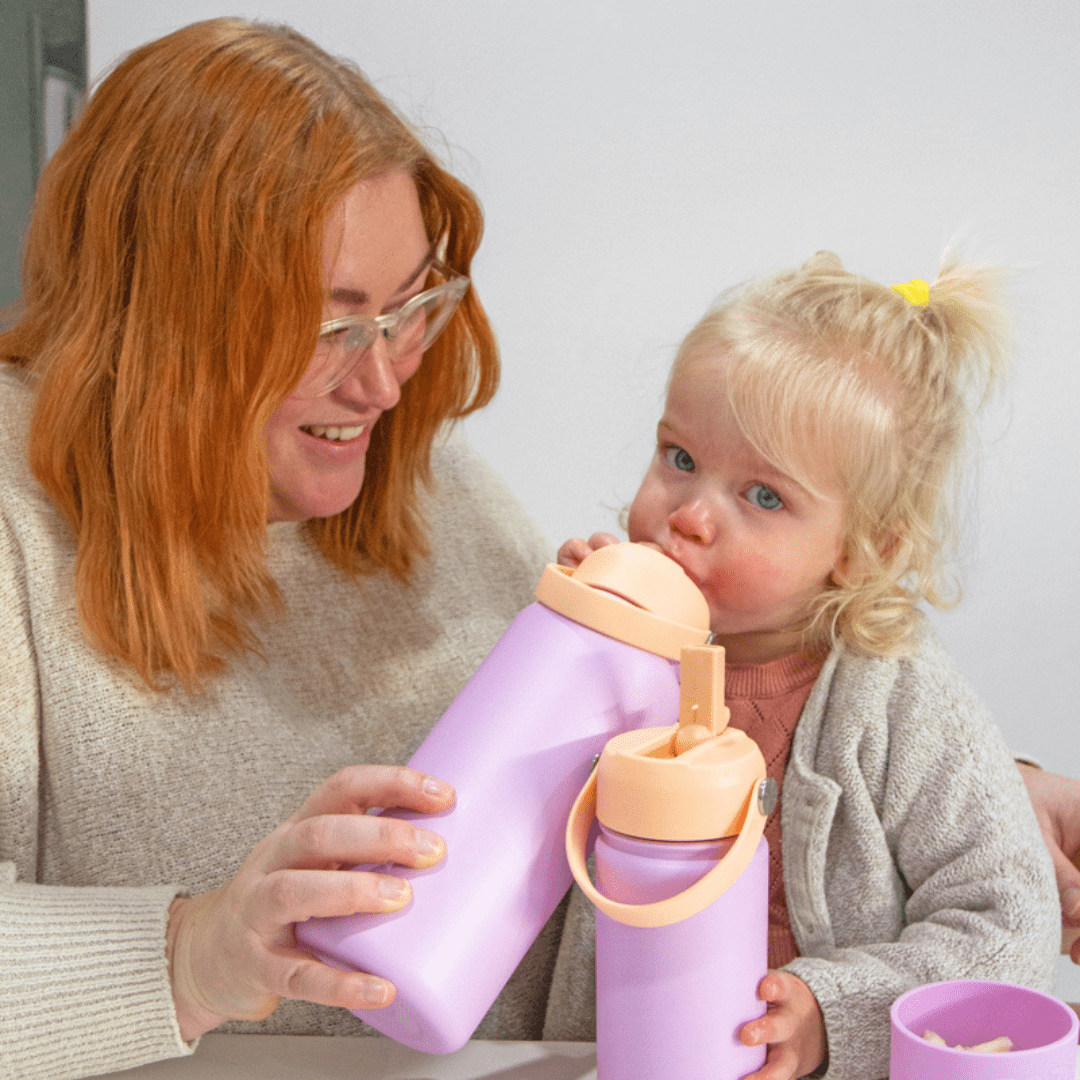 Mum-And-Daughter-Using-Zazi-Flexiflask-Drink-Bottle-1L-Peach-Sherbert-Naked-Baby-Eco-Boutique
