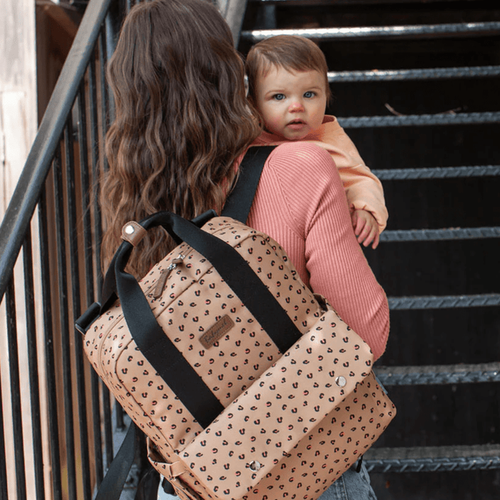 Mum-Holding-Baby-and-Babymel-Georgi-Eco-Convertible-Nappy-Backpack-Caramel-Leopard-Naked-Baby-Eco-Boutique