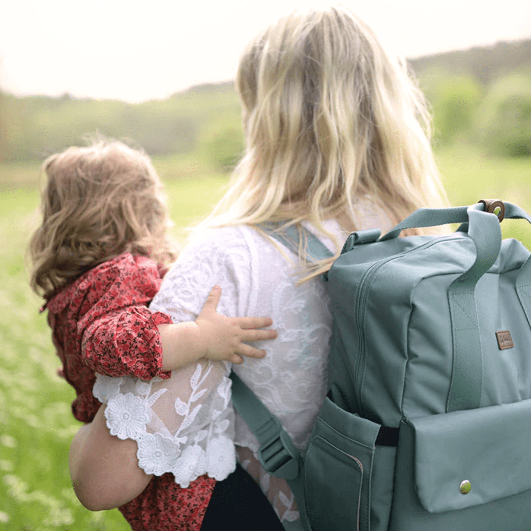 Mum-in-Field-Wearing-Babymel-Georgi-Eco-Convertible-Nappy-Backpack-Aqua-as-a-Backpack-Naked-Baby-Eco-Boutique
