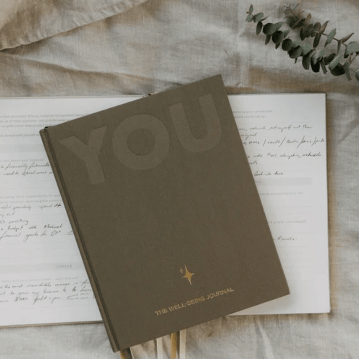 Olive-Journal-Ontop-Of-Open-Journal-Olive-And-Page-You-The-Well-Being-Journal-Sand-Naked-Baby-Eco-Boutique