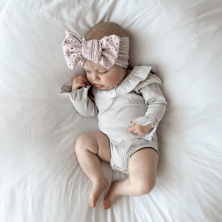 Sleepy-Baby-Wearing-Aster-And-Organic-Lavender-Pointelle-Rib-Onesie-Naked-Baby-Eco-Boutique