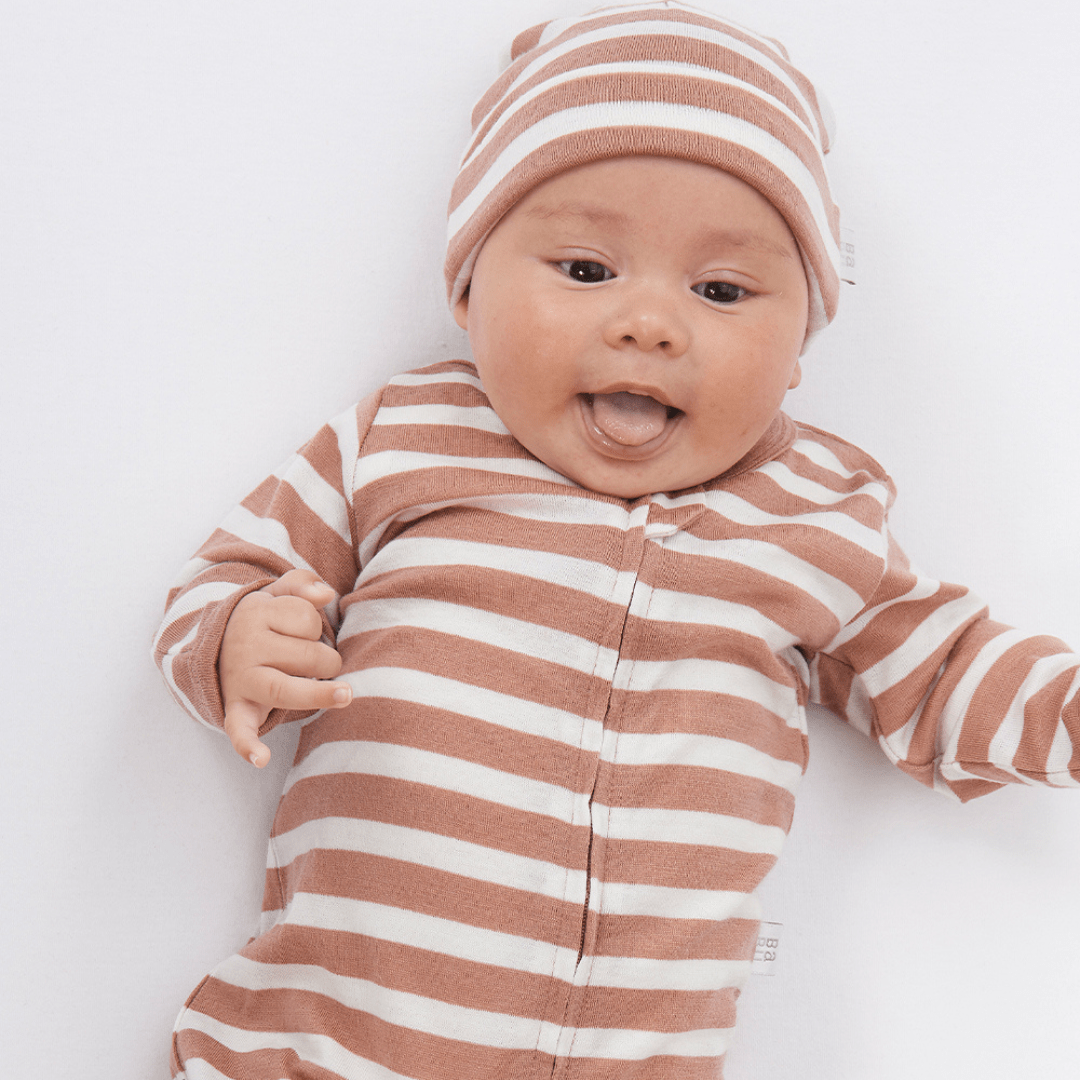 Smiling-Baby-Wearing-Adorable-Baby-Wearing-Babu-Merino-Baby-Hat-Babu-Rose-Stripe-Naked-Baby-Eco-Boutique