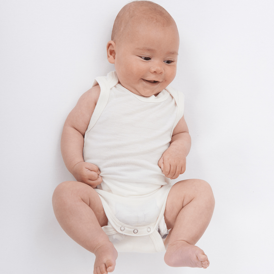 Smiling-Baby-Wearing-Babu-Merino-Wool-Singlet-Onesie-Naked-Baby-Eco-Boutique