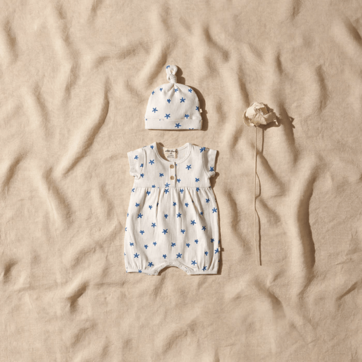 Blue and white polka dot romper and hat by Wilson & Frenchy. This Wilson & Frenchy Little Starfish Organic Rib Playsuit is an OUTLET item.