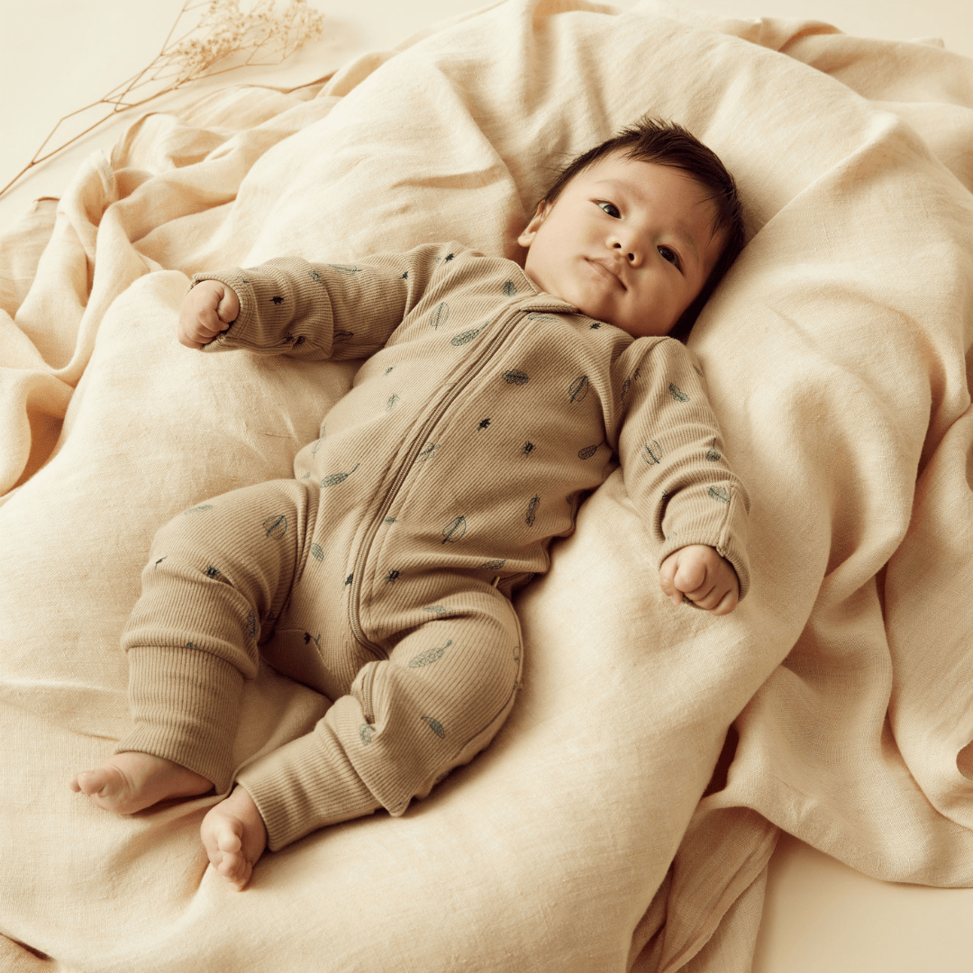 Styled-Image-With-Baby-Wearing-Wilson-And-Frenchy-Organic-Rib-Baby-Pyjamas-Jungle-Leaf-Naked-Baby-Eco-Boutique