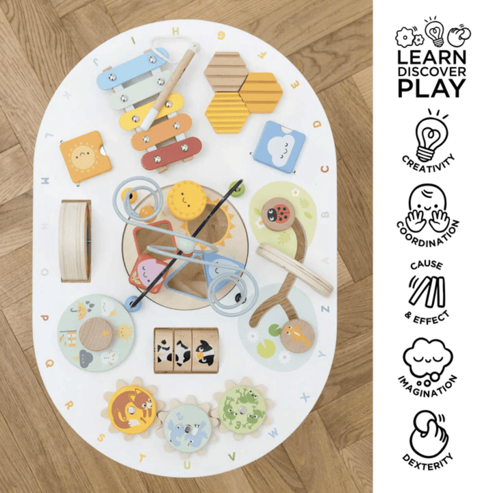 The Le Toy Van Activity Table is an eco-friendly gift featuring a variety of sensory toys for toddlers.