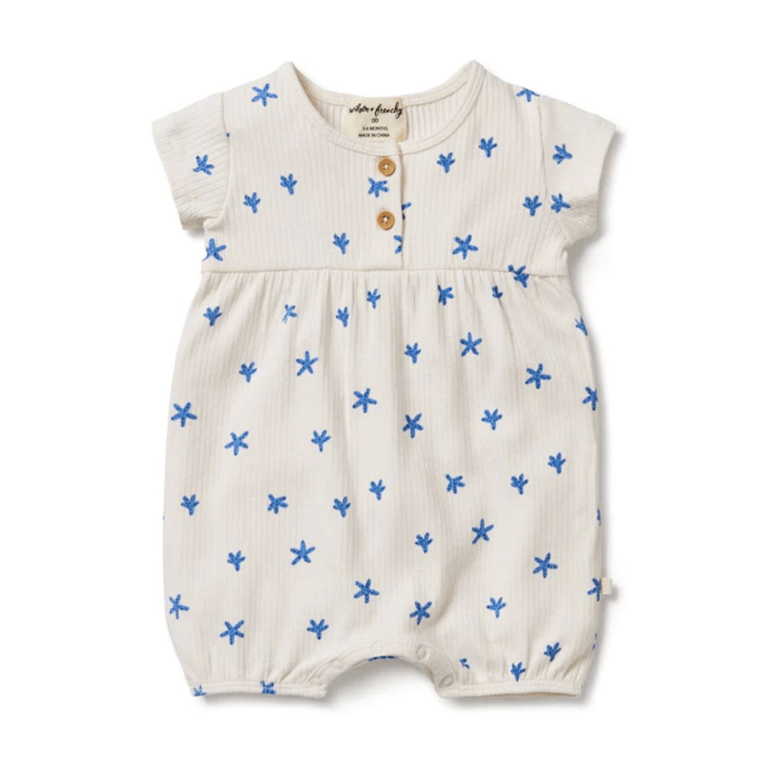This Wilson & Frenchy Little Starfish Organic Rib Playsuit features blue stars and is made of organic rib fabric.