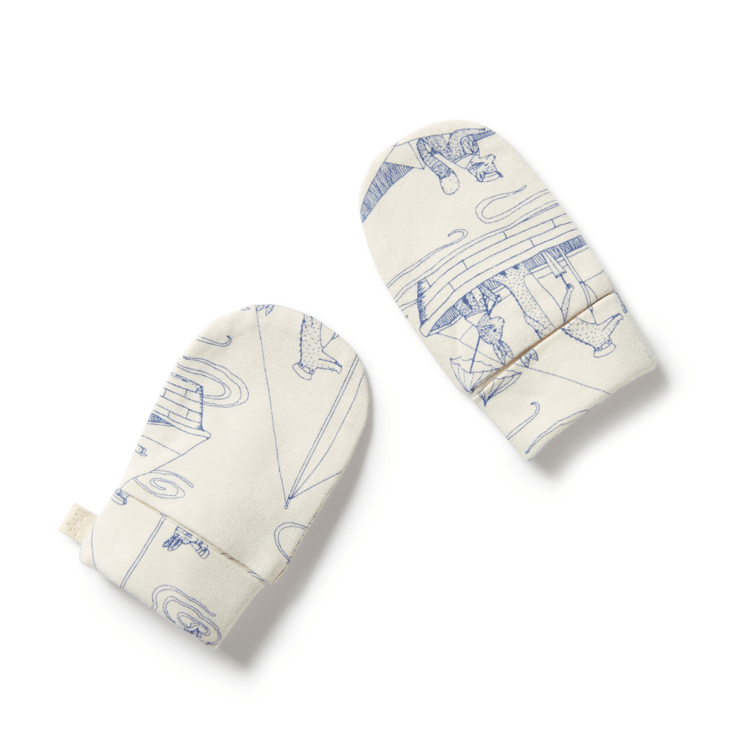 A pair of patterned Wilson & Frenchy Organic Baby Mittens on a white surface.