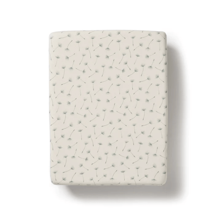 A Wilson & Frenchy Organic Cotton Bassinet Sheet isolated on a white background.
