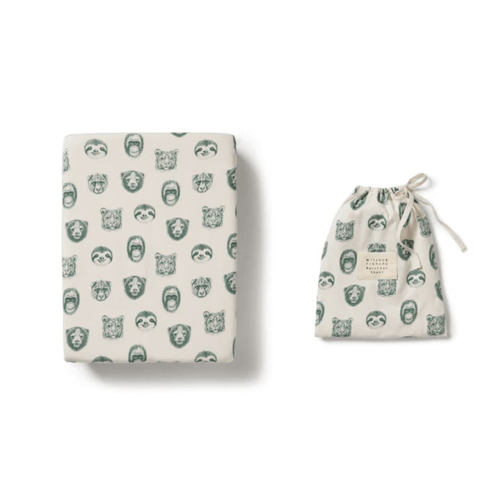 Wilson & Frenchy Folded blanket and drawstring bag with matching animal print designs, crafted from an organic cotton blend.