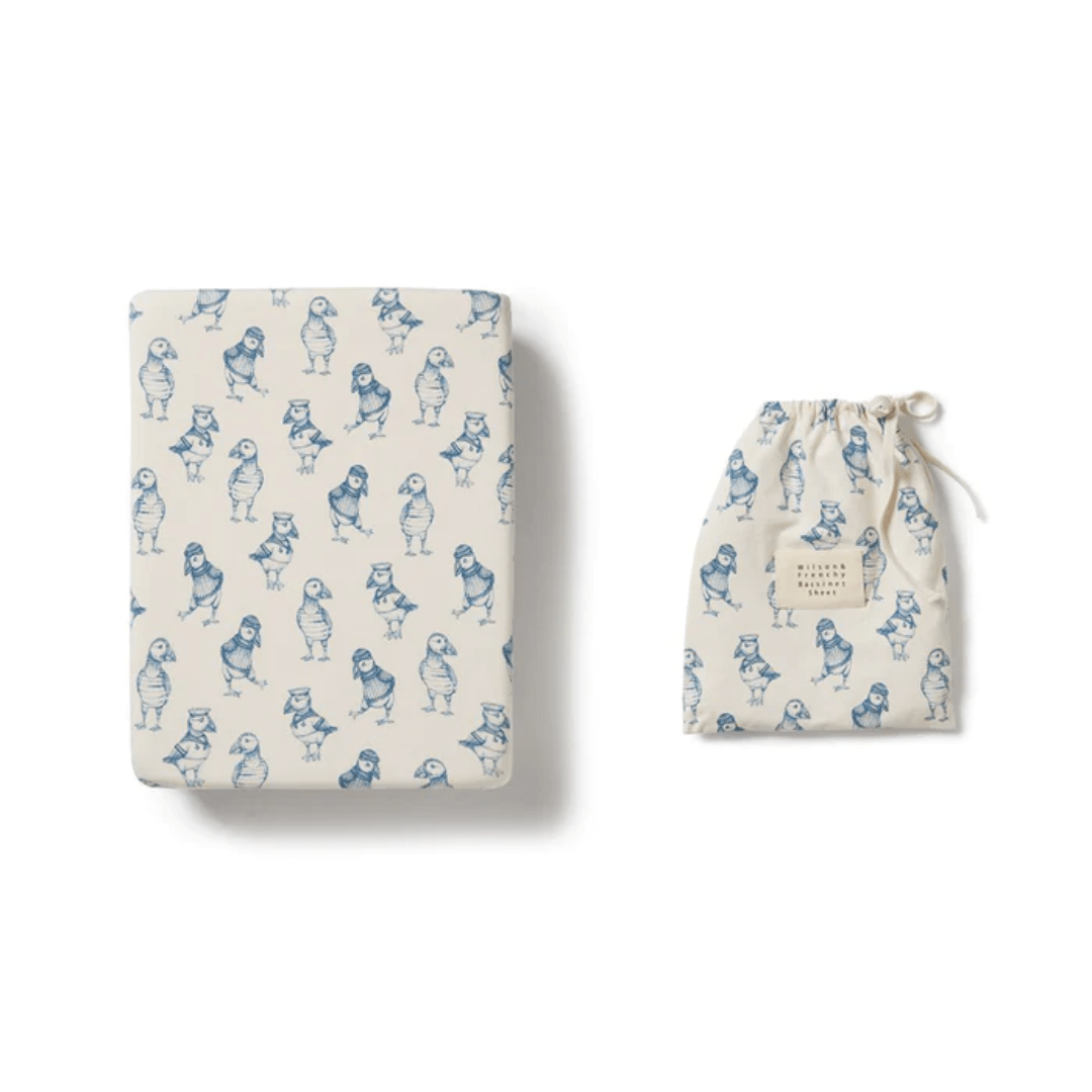 Matching Wilson & Frenchy journal and drawstring pouch with blue bear print on a white background, made from an organic cotton blend.