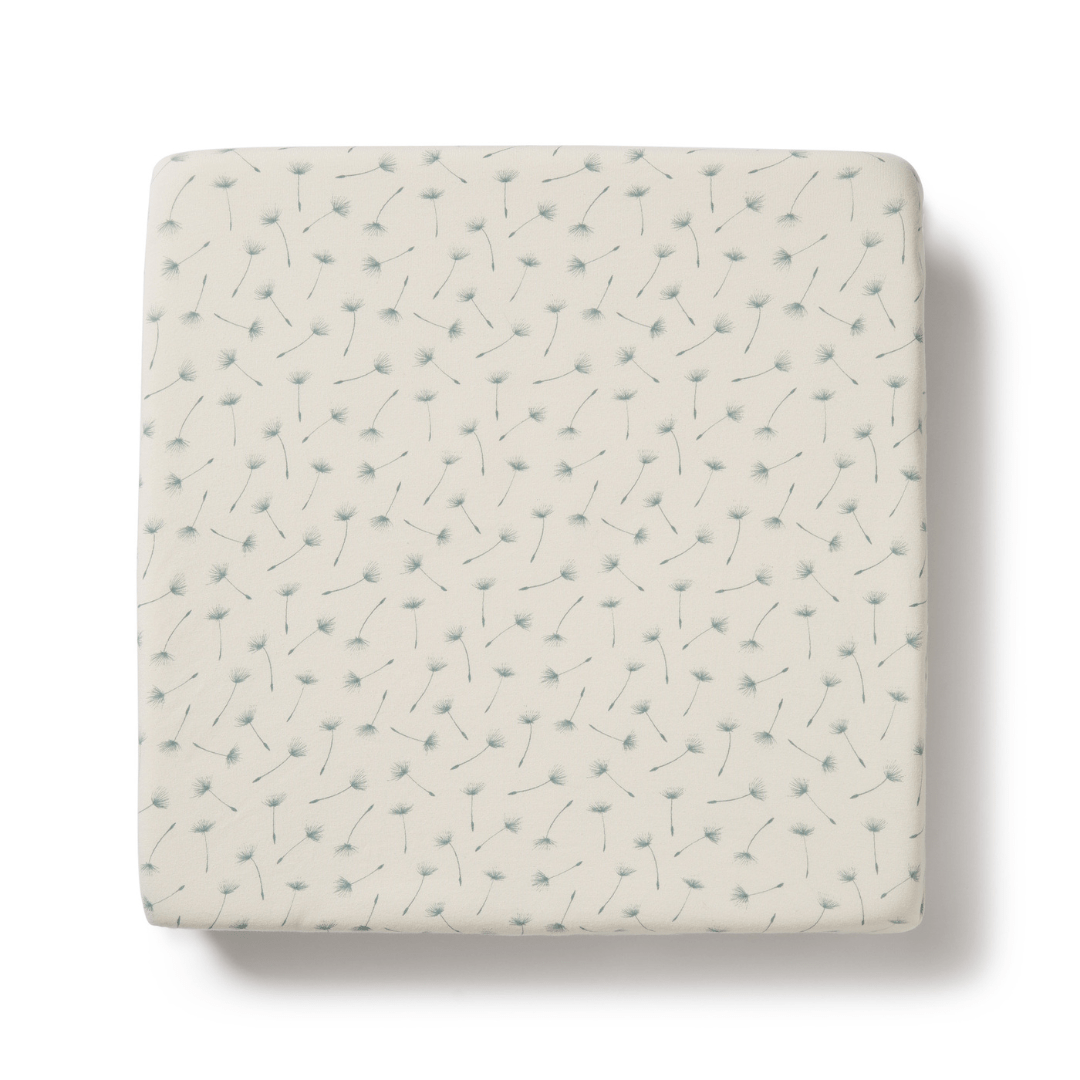 A Wilson & Frenchy Organic Cotton Cot Sheet - LUCKY LASTS - FLOAT AWAY ONLY, perfect as a baby shower present, featuring a white square with a blue and white pattern on it.