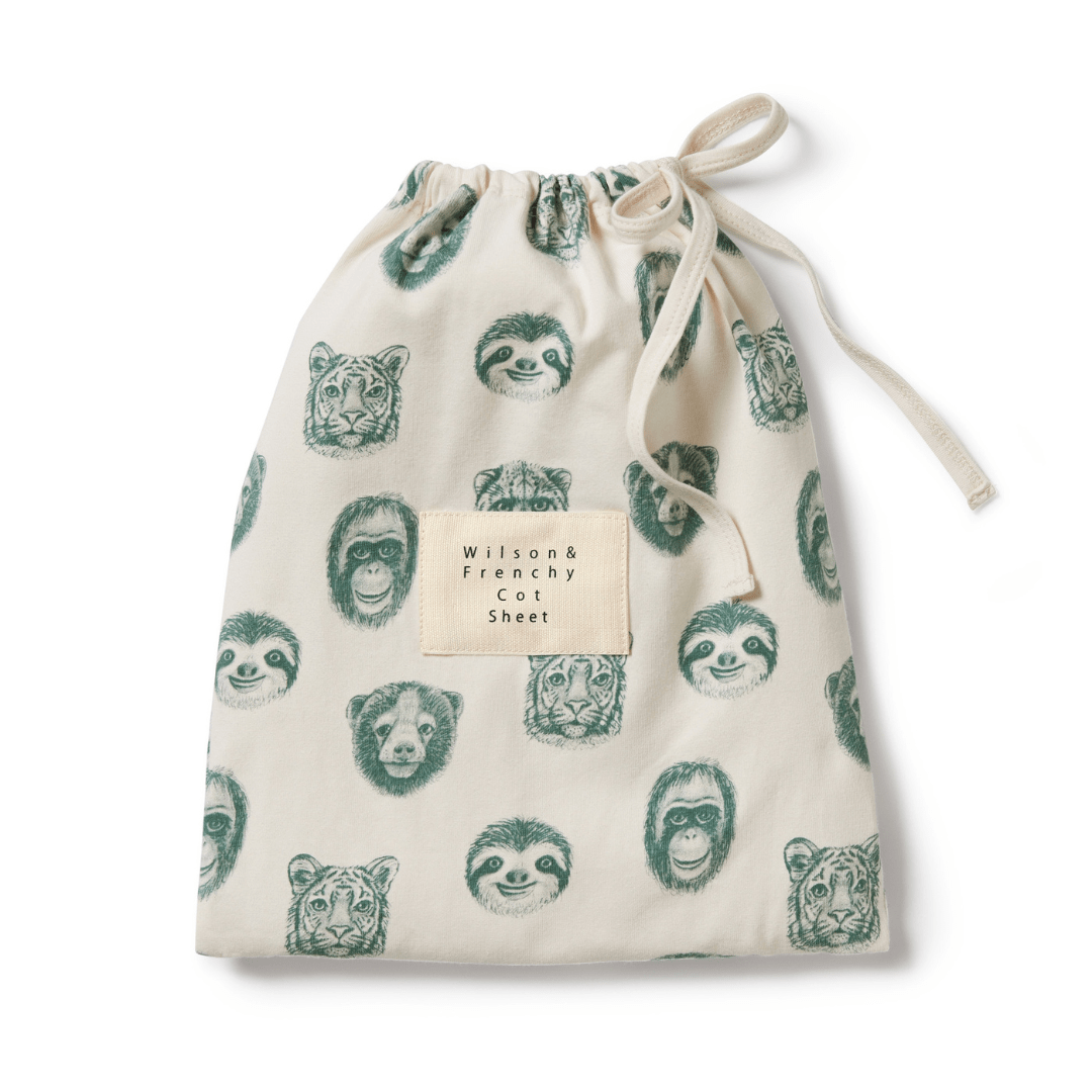 An Wilson & Frenchy Organic Cotton Cot Sheet - LUCKY LASTS - FLOAT AWAY ONLY bag with a bear print, perfect for a baby shower present.