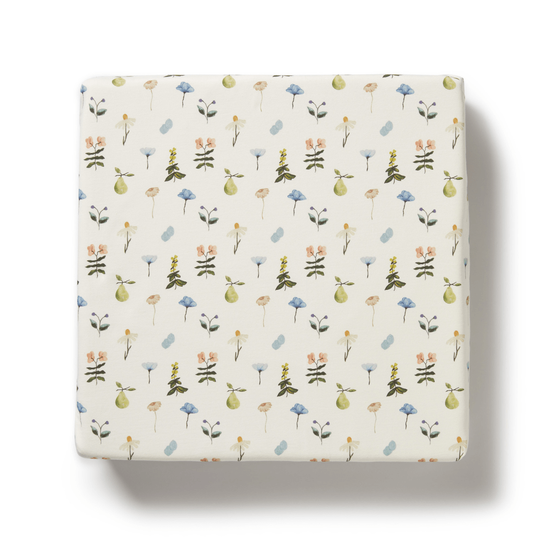 Wilson-And-Frenchy-Organic-Cotton-Cot-Sheet-Petit-Garden-Naked-Baby-Eco-Boutique with floral pattern on white background, designed for Wilson & Frenchy Organic Cotton Cot Sheet in organic cotton.