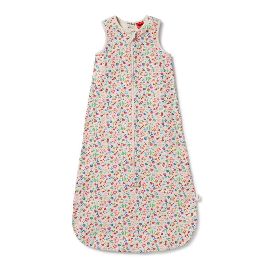 A Wilson & Frenchy Organic Cotton Summer Sleeping Bag - LUCKY LAST - TROPICAL GARDEN - 6-12 MONTHS ONLY in a floral print, perfect for a restful summer sleep.
