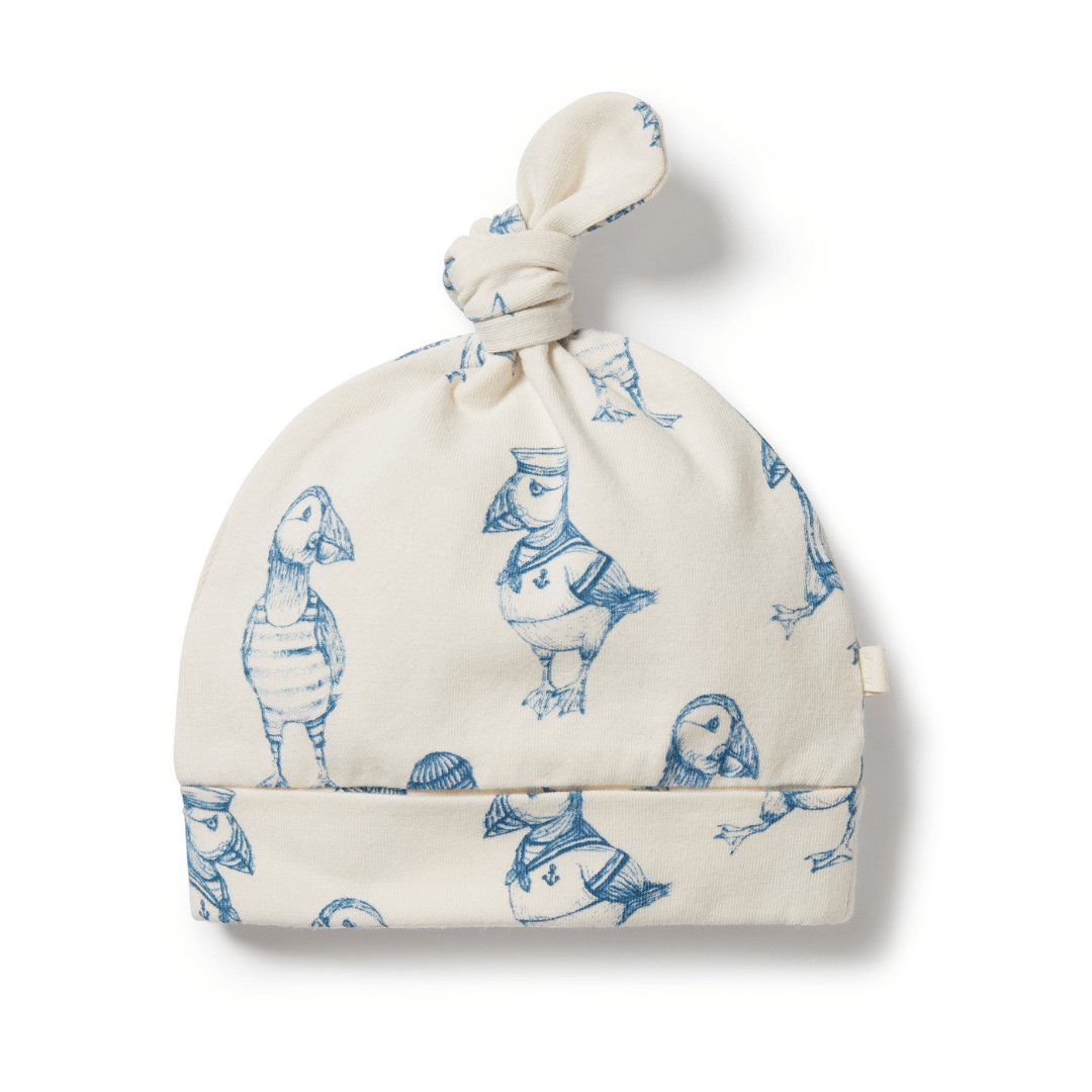 Wilson & Frenchy Organic Knot Hat with bird print design on a white background.