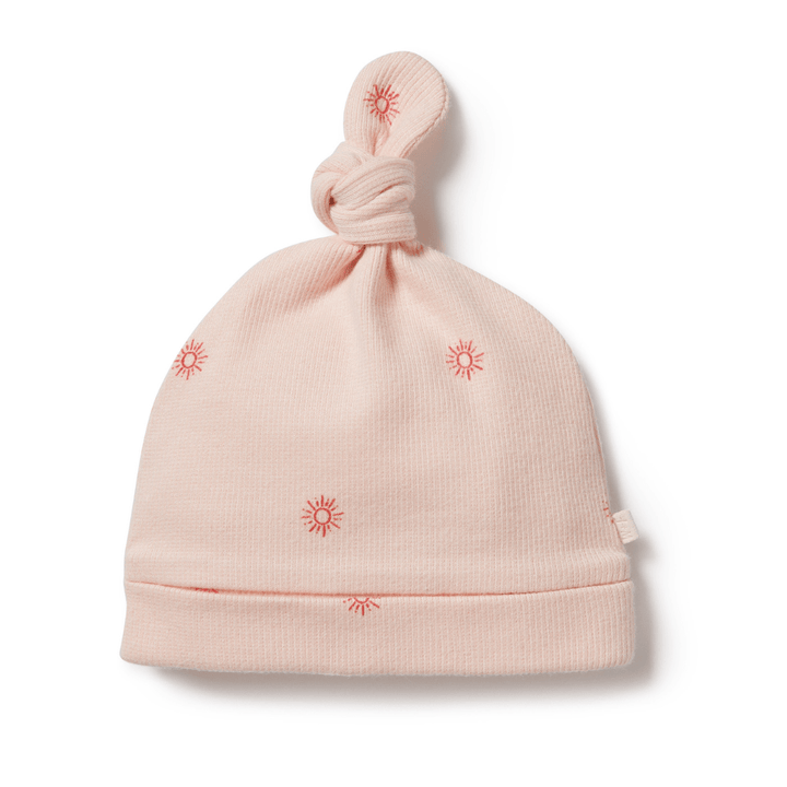 A pink Wilson & Frenchy Organic Rib Knot Hat with stars on it.
