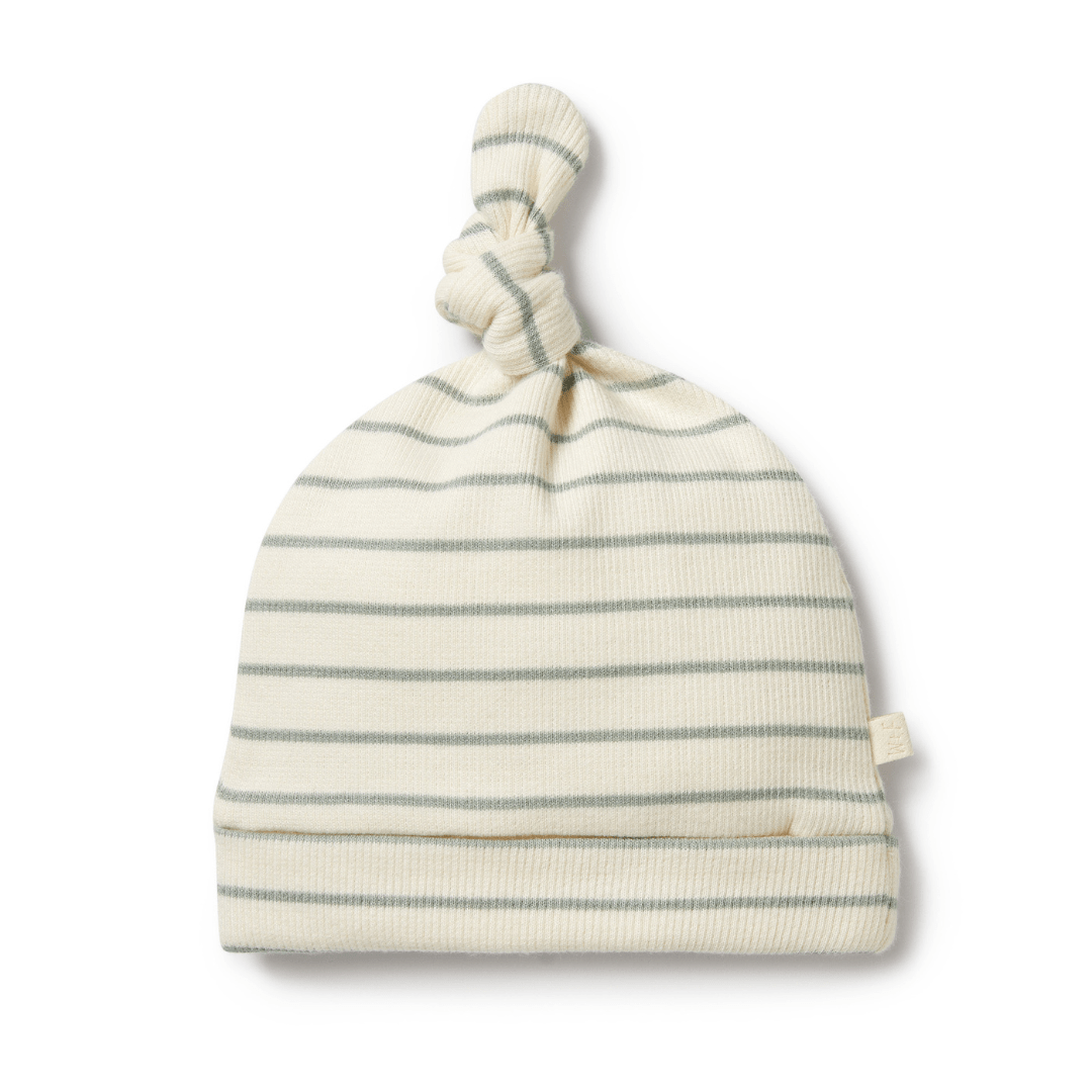 A white Wilson & Frenchy Organic Stripe Rib Knot Hat made of organic cotton on a white background.