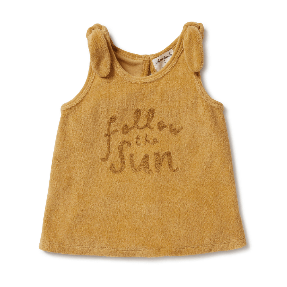 A Wilson & Frenchy Organic Terry Tie Kids Singlet (Multiple Variants) in yellow with the words "follow the sun" on it.