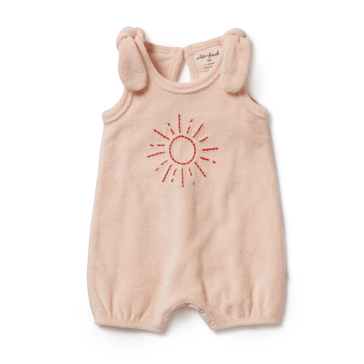 A Wilson & Frenchy Organic Terry Tie Playsuit (Multiple Variants) with an embroidered sun and snap-crotch closure.
