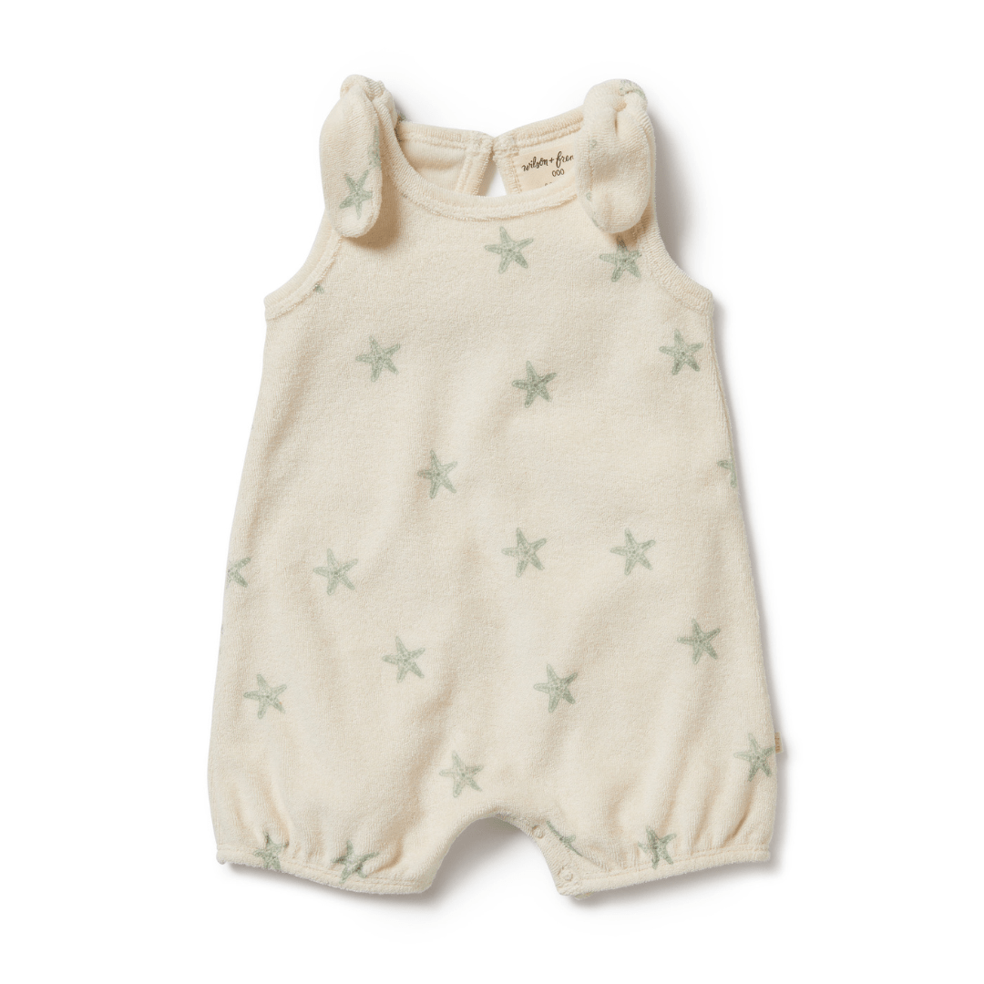 A Wilson & Frenchy Organic Terry Tie Playsuit (Multiple Variants) with stars on it.