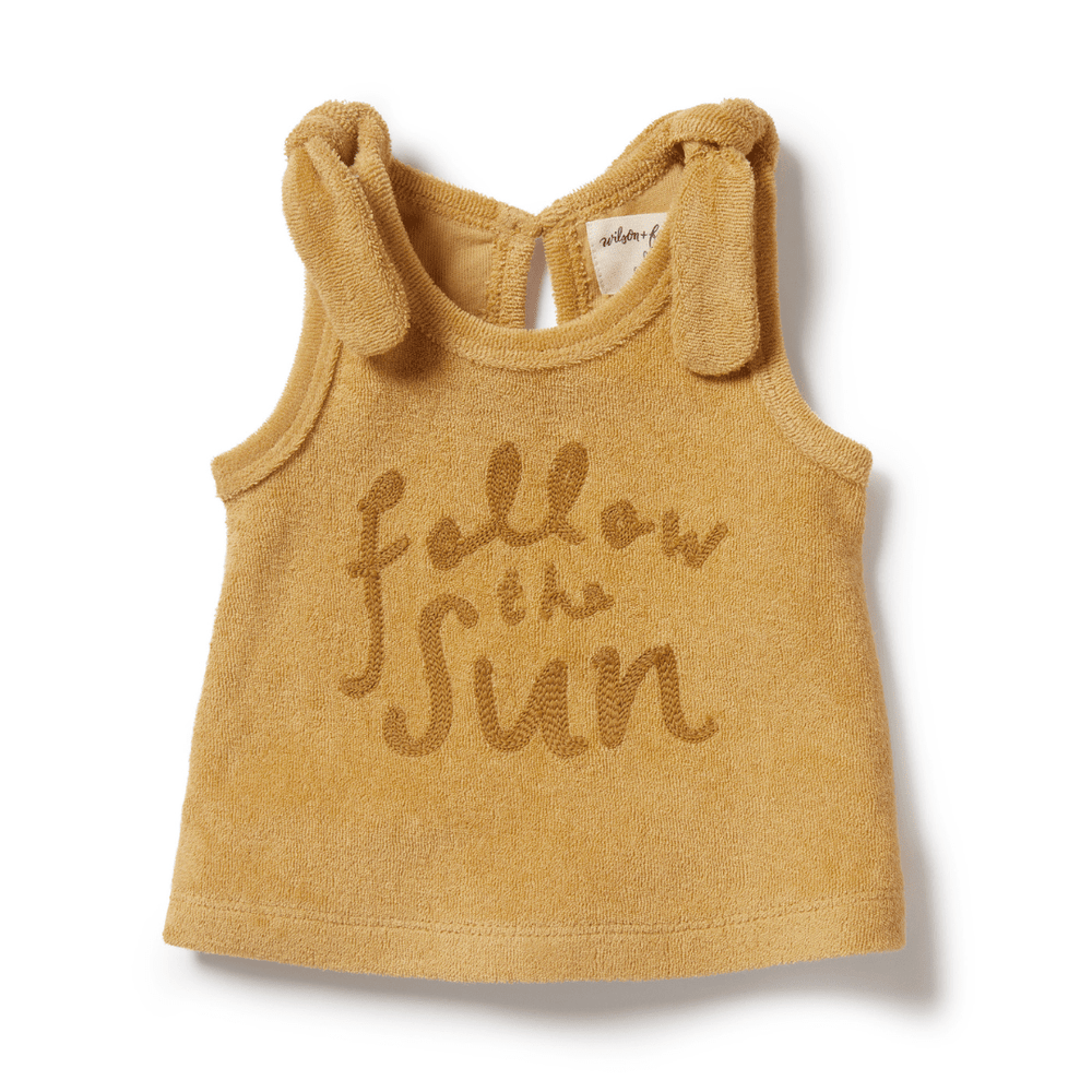 A yellow Wilson & Frenchy Organic Terry Tie Singlet made from GOTS-certified organic fabric.