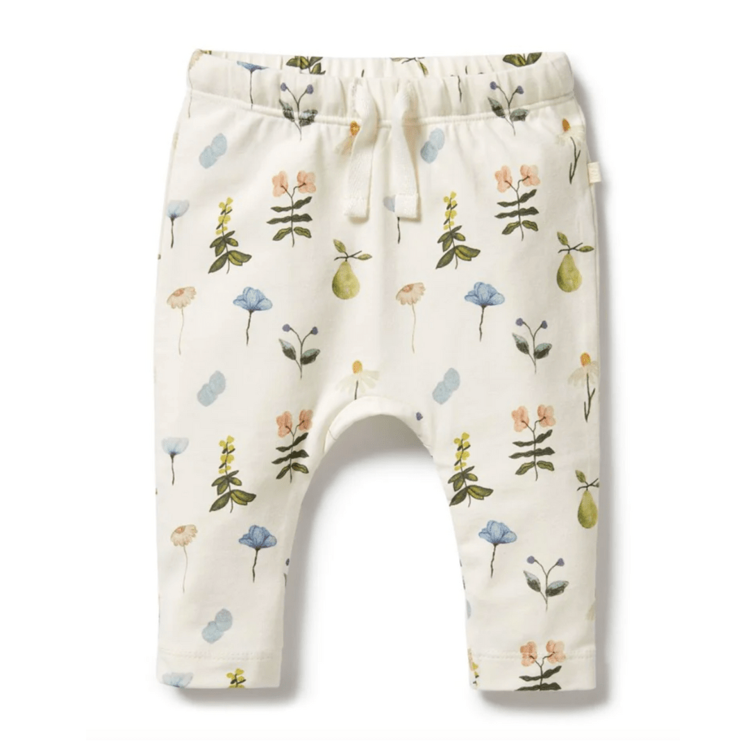 Wilson & Frenchy Organic Baby Leggings with floral print on a white background, made from GOTS-certified organic cotton.