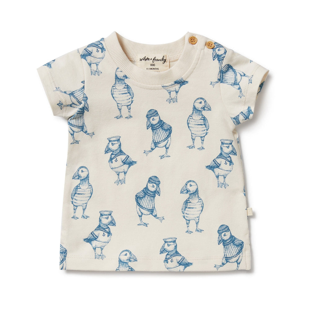 A Wilson & Frenchy Organic Tee - LUCKY LAST - HELLO JUNGLE - 0-3 MONTHS ONLY with soft, breathable fabric and a side-neck button opening, featuring adorable birds.