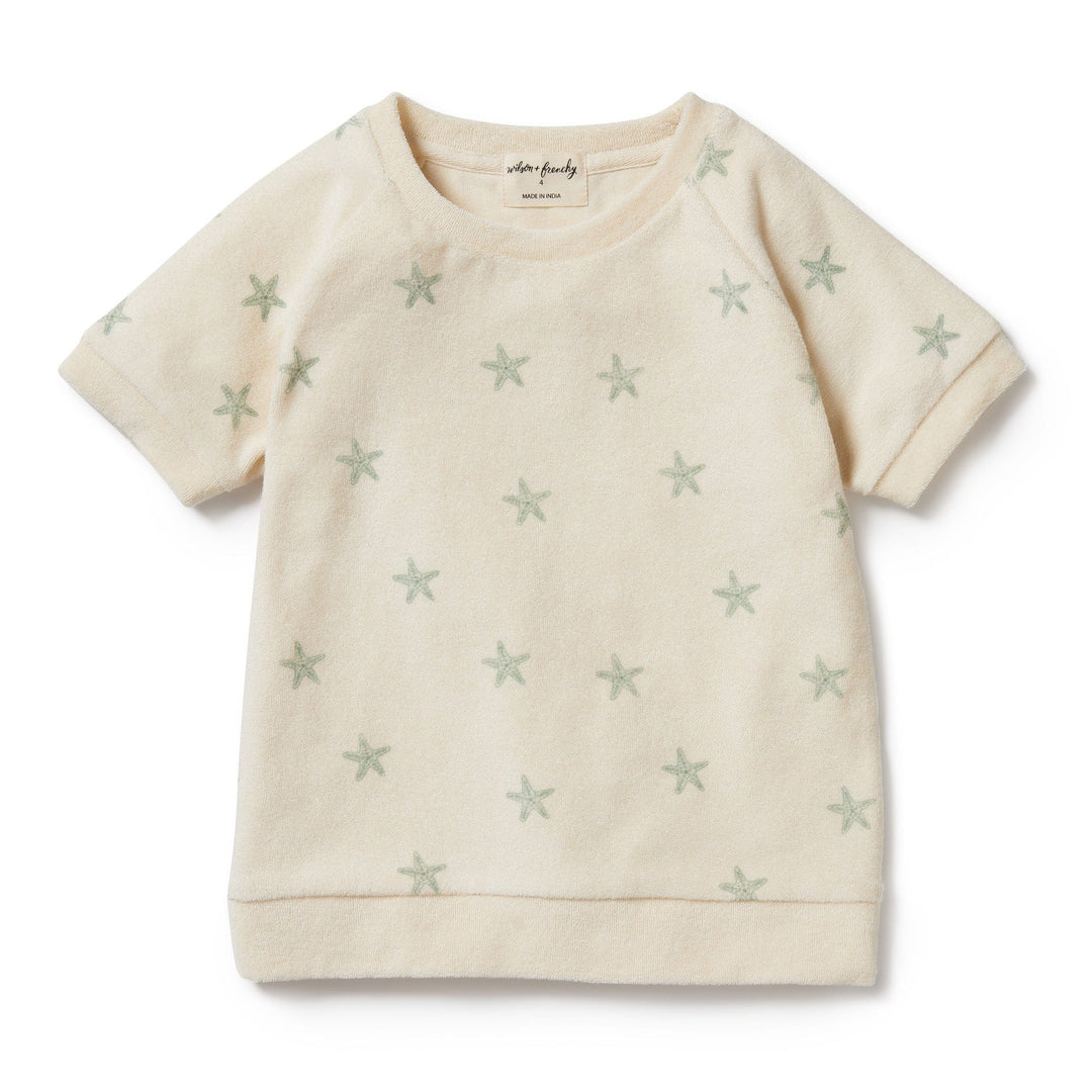 A Wilson & Frenchy Tiny Starfish Organic Terry Kids Sweat Top made of organic cotton, adorned with stars.