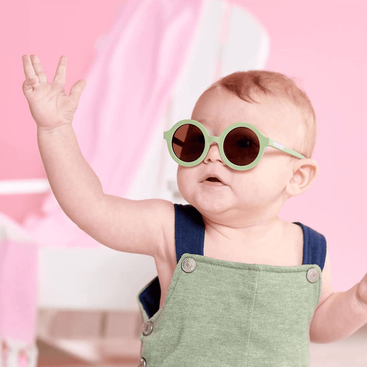 Adorable-Baby-Boy-Wearing-Babiators-Euro-Round-Baby-Kids-Sunglasses-All-the-Rage-Sage-Naked-Baby-Eco-Boutique