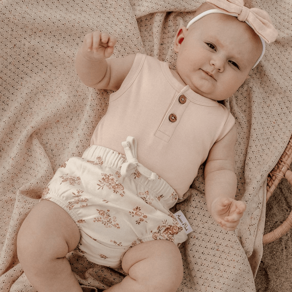 Adorable-Baby-Girl-Wearing-Aster-and-Oak-Organic-Posy-Floral-Bloomers-Naked-Baby-Eco-Boutique
