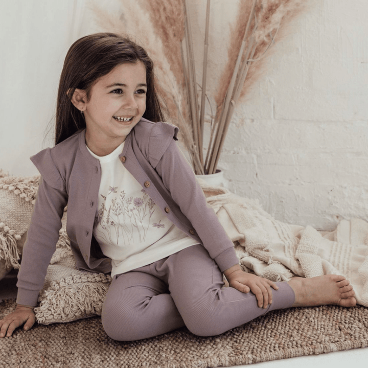 Adorable-Girl-Sitting-Wearing-Aster-and-Oak-Long-Sleeve-Tee-Wildflower-and-Coordinates-Naked-Baby-Eco-Boutique